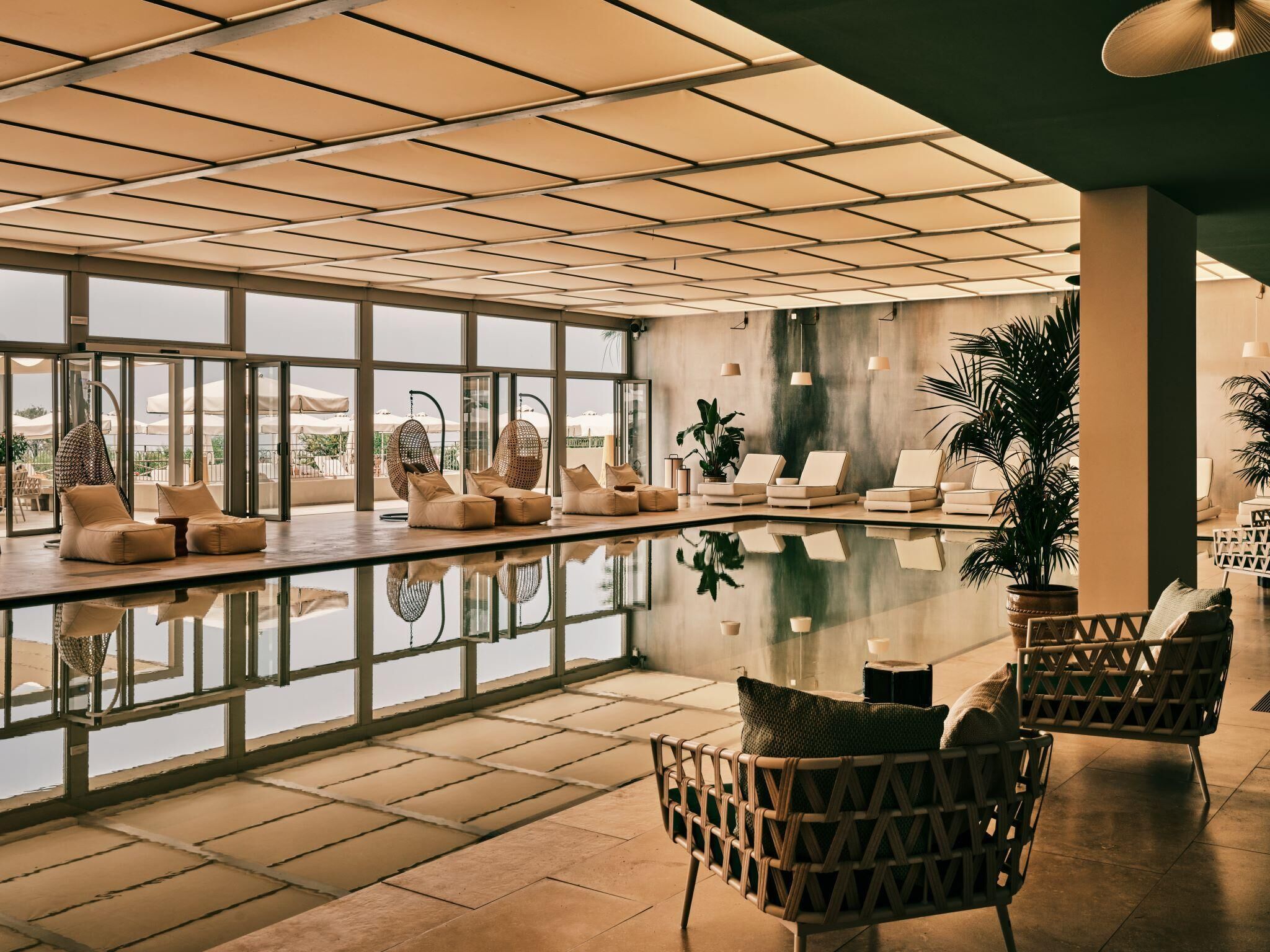Indoor pool, outdoor pool, pool umbrellas, sun loungers