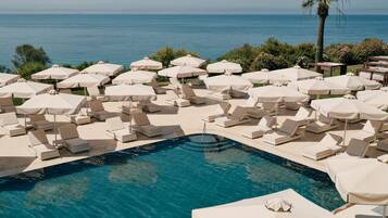 Indoor pool, outdoor pool, pool umbrellas, pool loungers