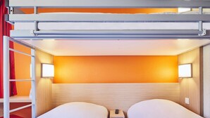 A bunk bed room with a ladder, two bedside tables, and a wall-mounted light fixture. - Hôtel Premiere Classe Melun Senart - Vert Saint Denis (Vert-Saint-Denis)