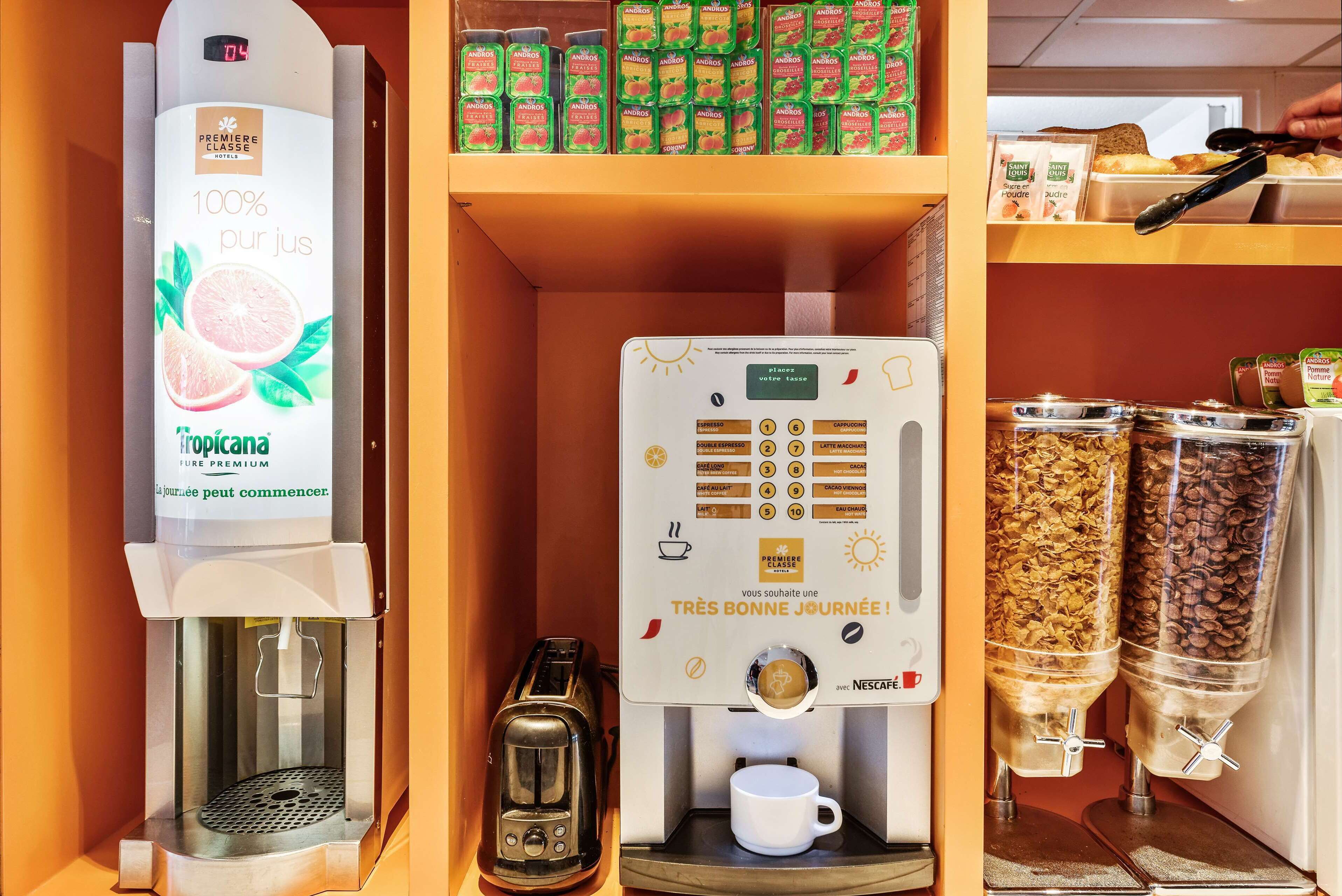 A coffee machine with a digital display, a toaster, and a coffee dispenser.