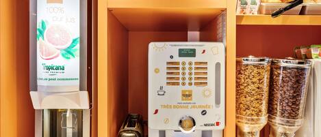 A coffee machine with a digital display, a toaster, and a coffee dispenser.