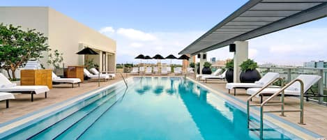 Outdoor pool, pool umbrellas, sun loungers