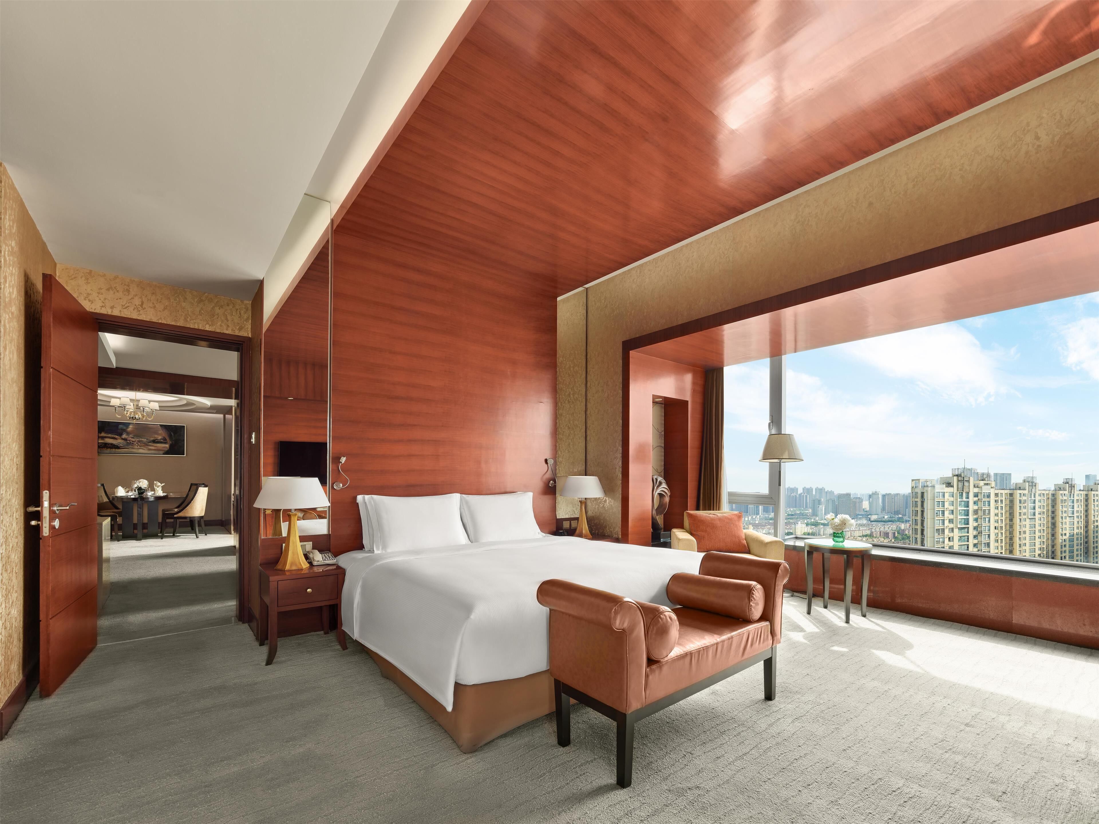 king premium suite | premium bedding, free minibar items, in-room safe, iron/ironing board