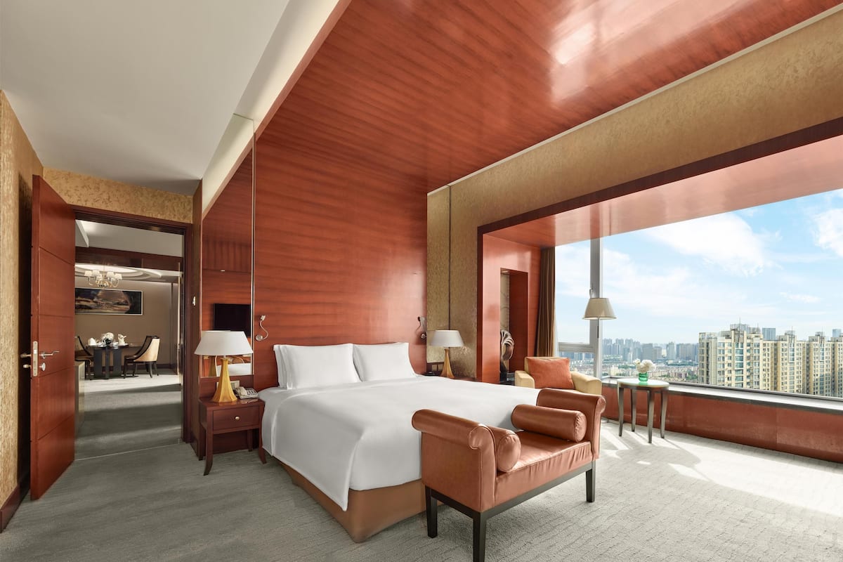 king premium suite | premium bedding, free minibar items, in-room safe, iron/ironing board