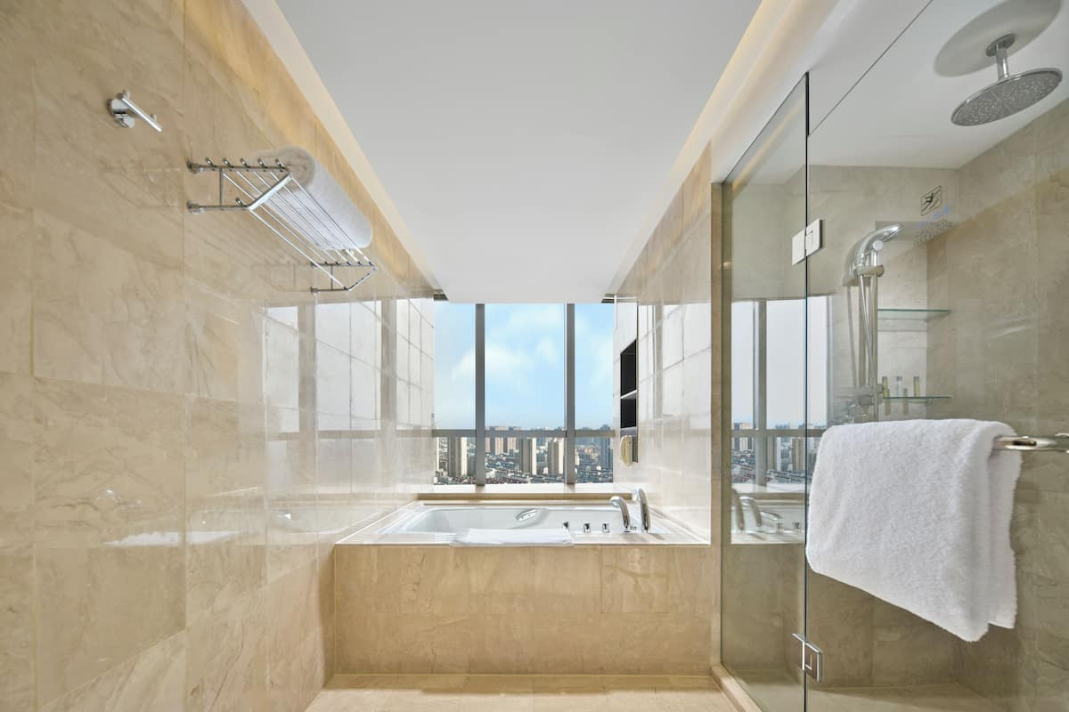 separate bathtub and shower, deep-soaking bathtub, rainfall showerhead