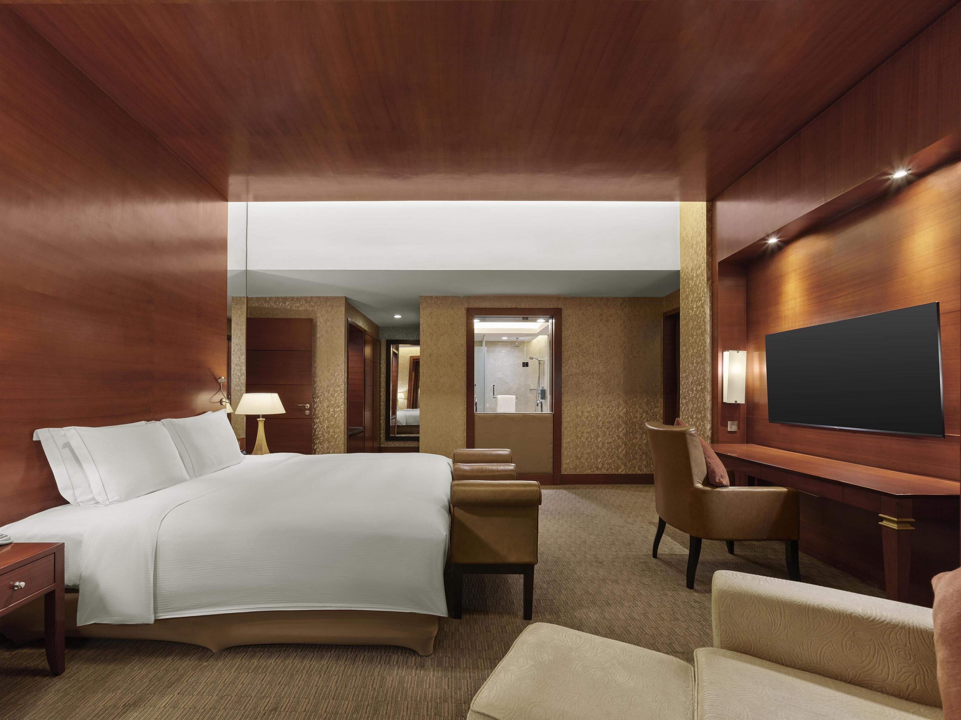 king premium suite | premium bedding, free minibar items, in-room safe, iron/ironing board