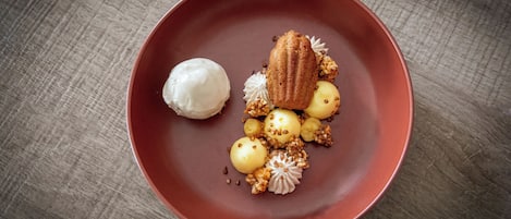 A dessert on a red plate with a wooden table background.