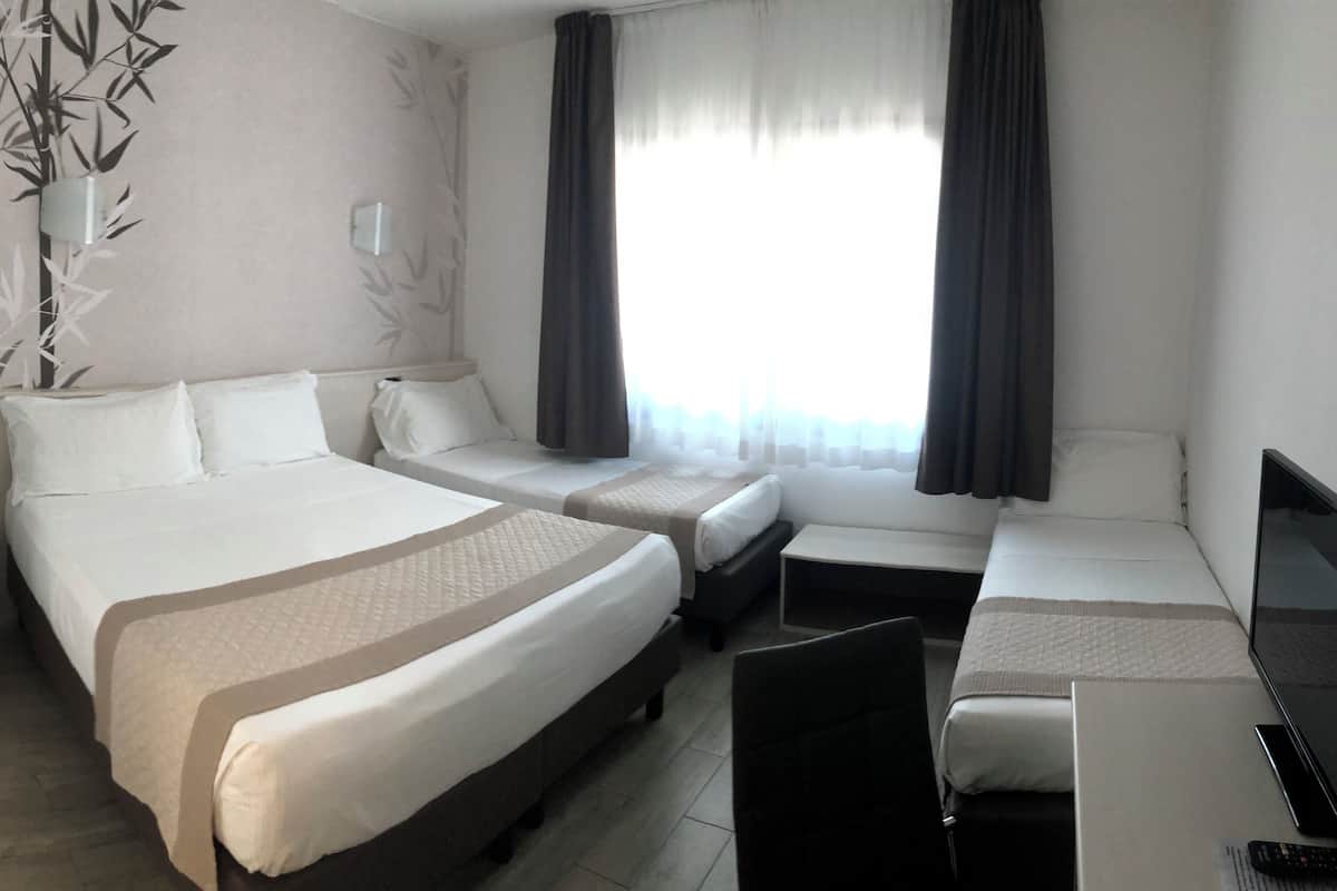 Standard Quadruple Room | Minibar, in-room safe, desk, soundproofing