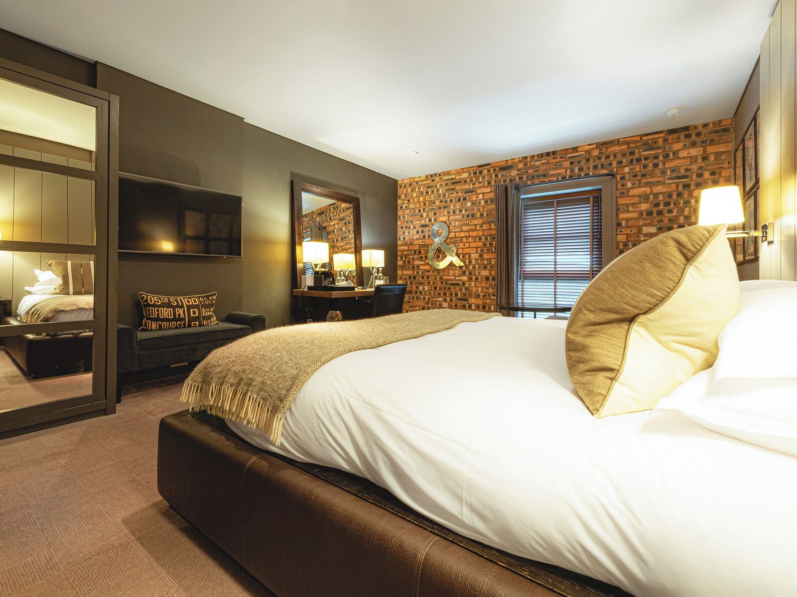 Premium bedding, desk, laptop workspace, iron/ironing board