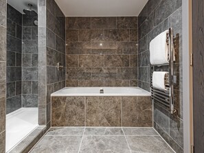 Deluxe Suite | Bathroom | Designer toiletries, hair dryer, towels, soap