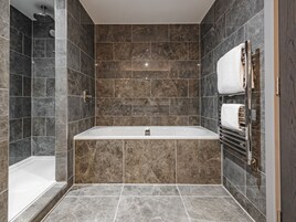 Deluxe Suite | Bathroom | Designer toiletries, hair dryer, towels, soap