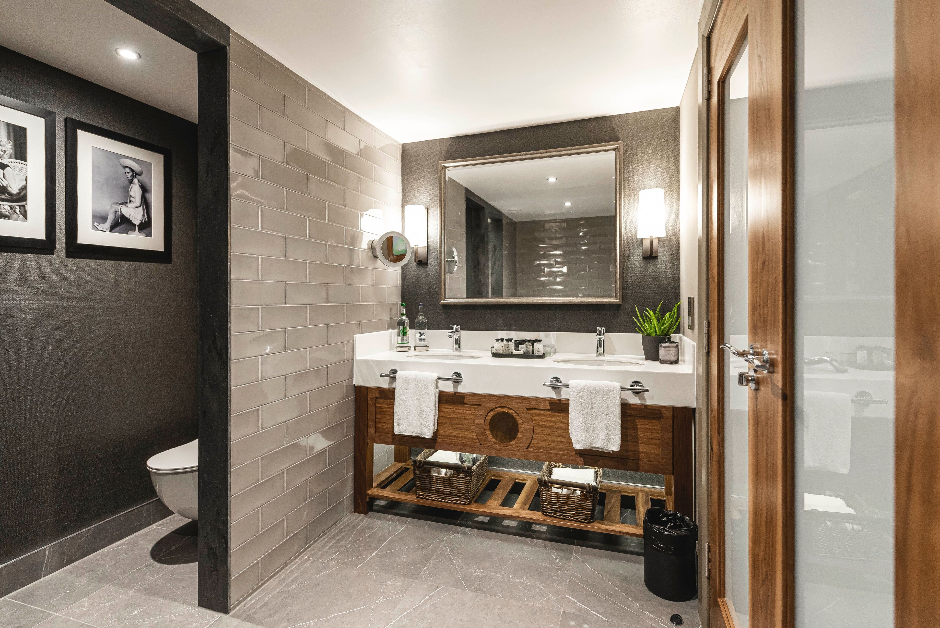 deluxe suite | bathroom | designer toiletries, hair dryer, towels, soap