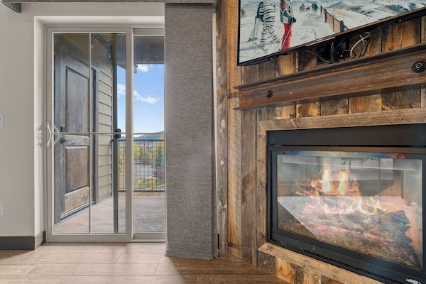 3 Bedroom Condo 2402 | Living area | LED TV, fireplace, DVD player