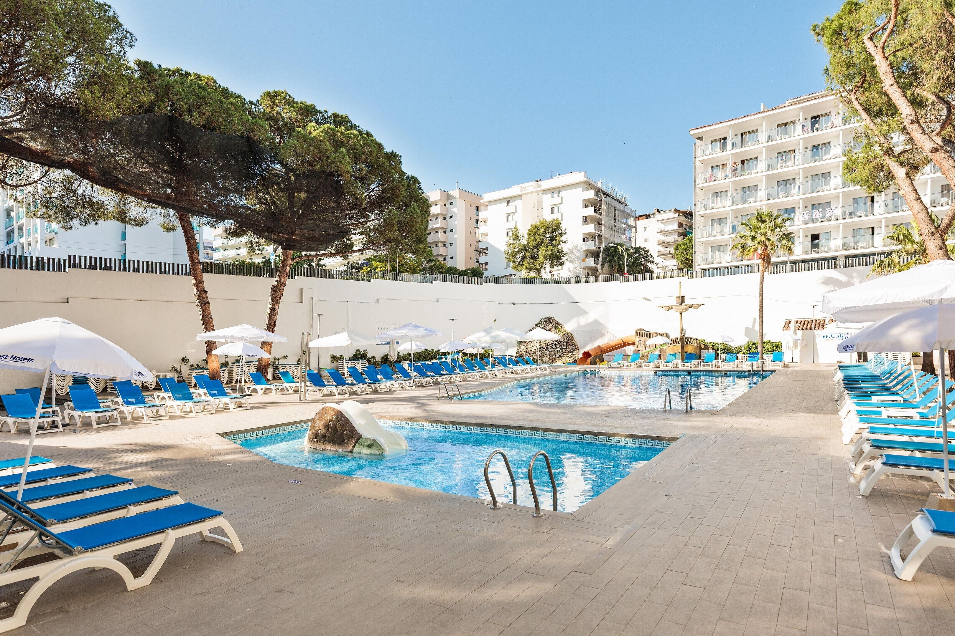 Indoor pool, outdoor pool, pool umbrellas, pool loungers