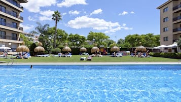 Indoor pool, outdoor pool, pool umbrellas