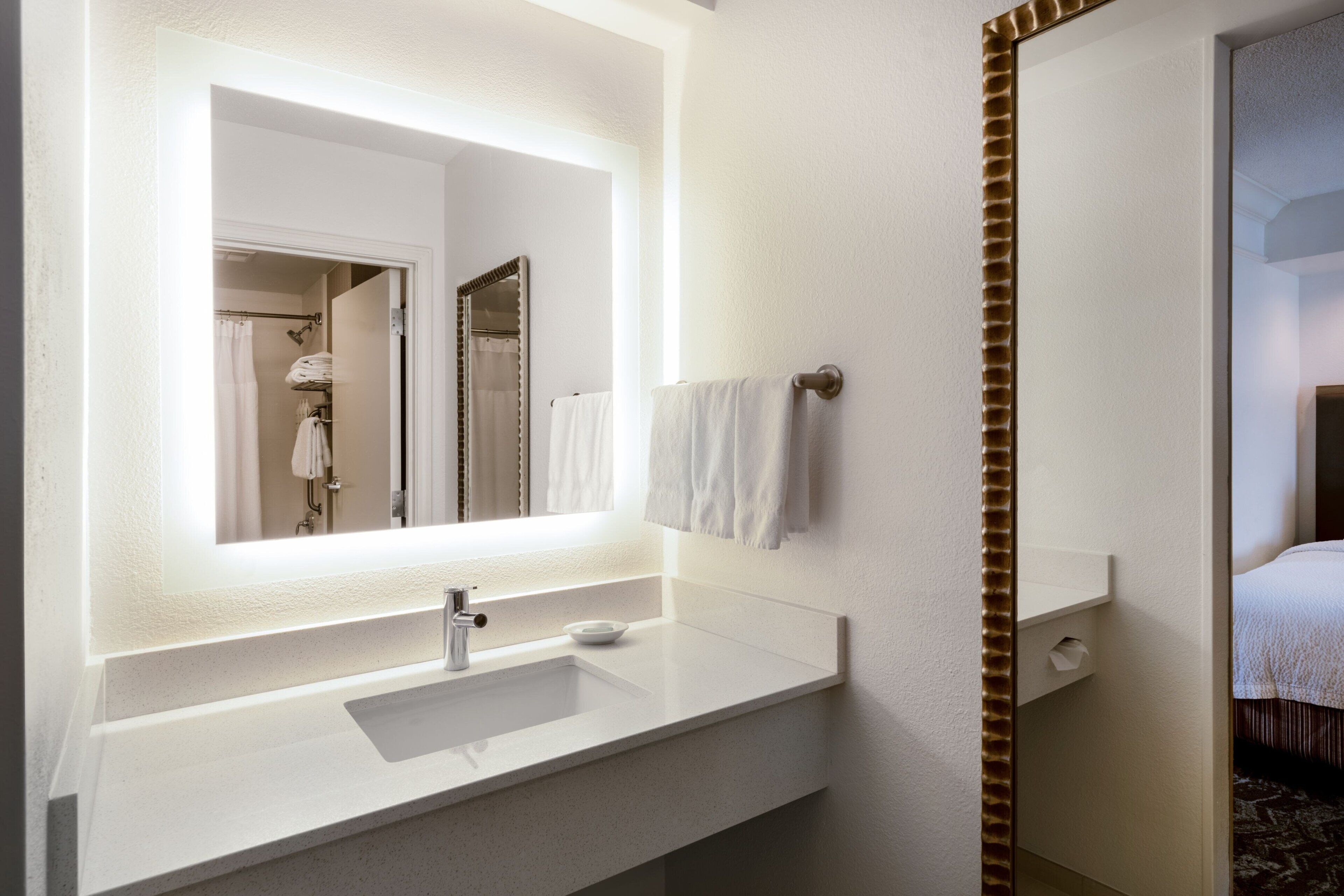 combined shower/bathtub, designer toiletries, hair dryer, towels