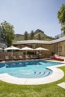 Indoor pool, outdoor pool, open 9 AM to 8 PM, pool umbrellas