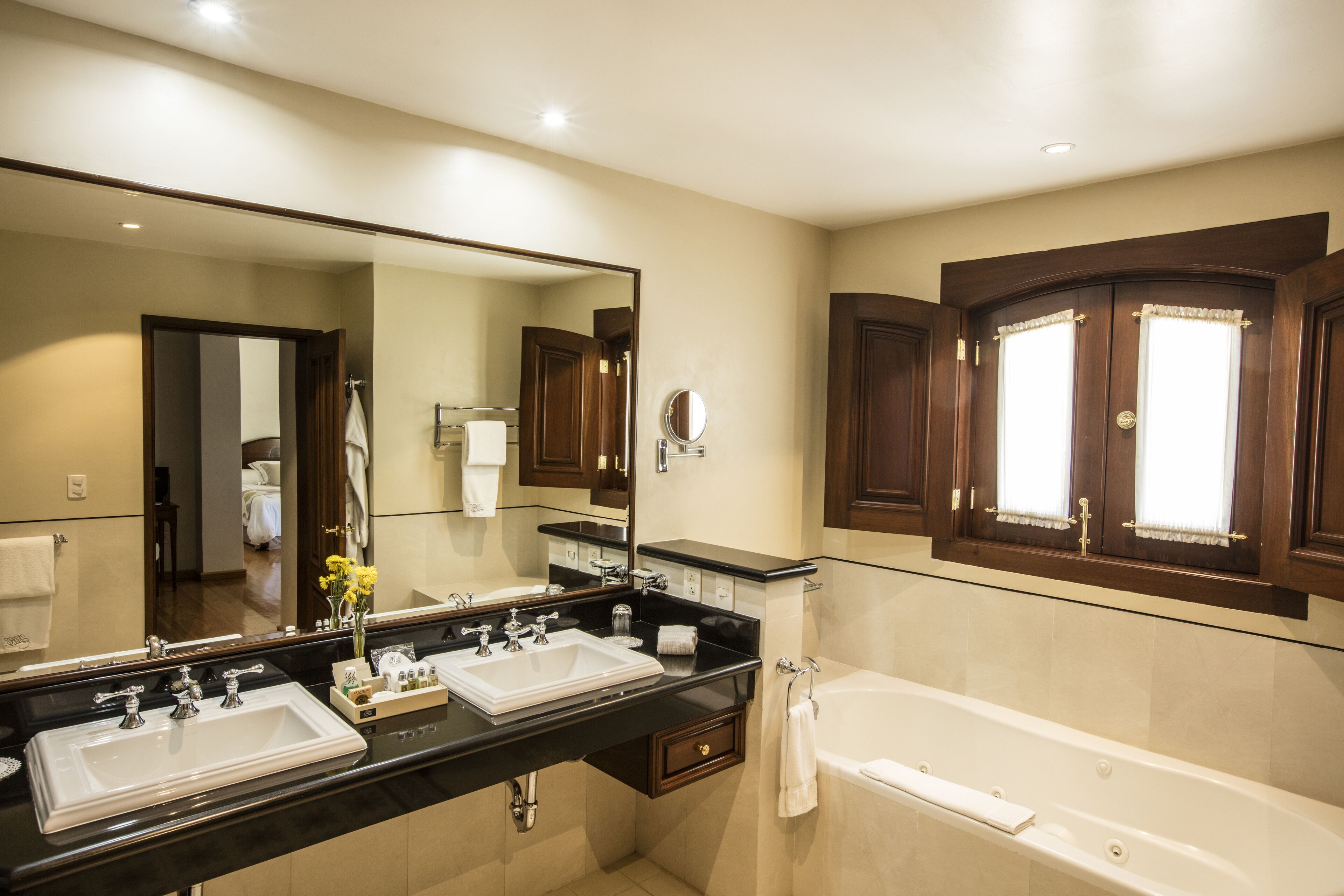 combined shower/bathtub, designer toiletries, hair dryer, bathrobes