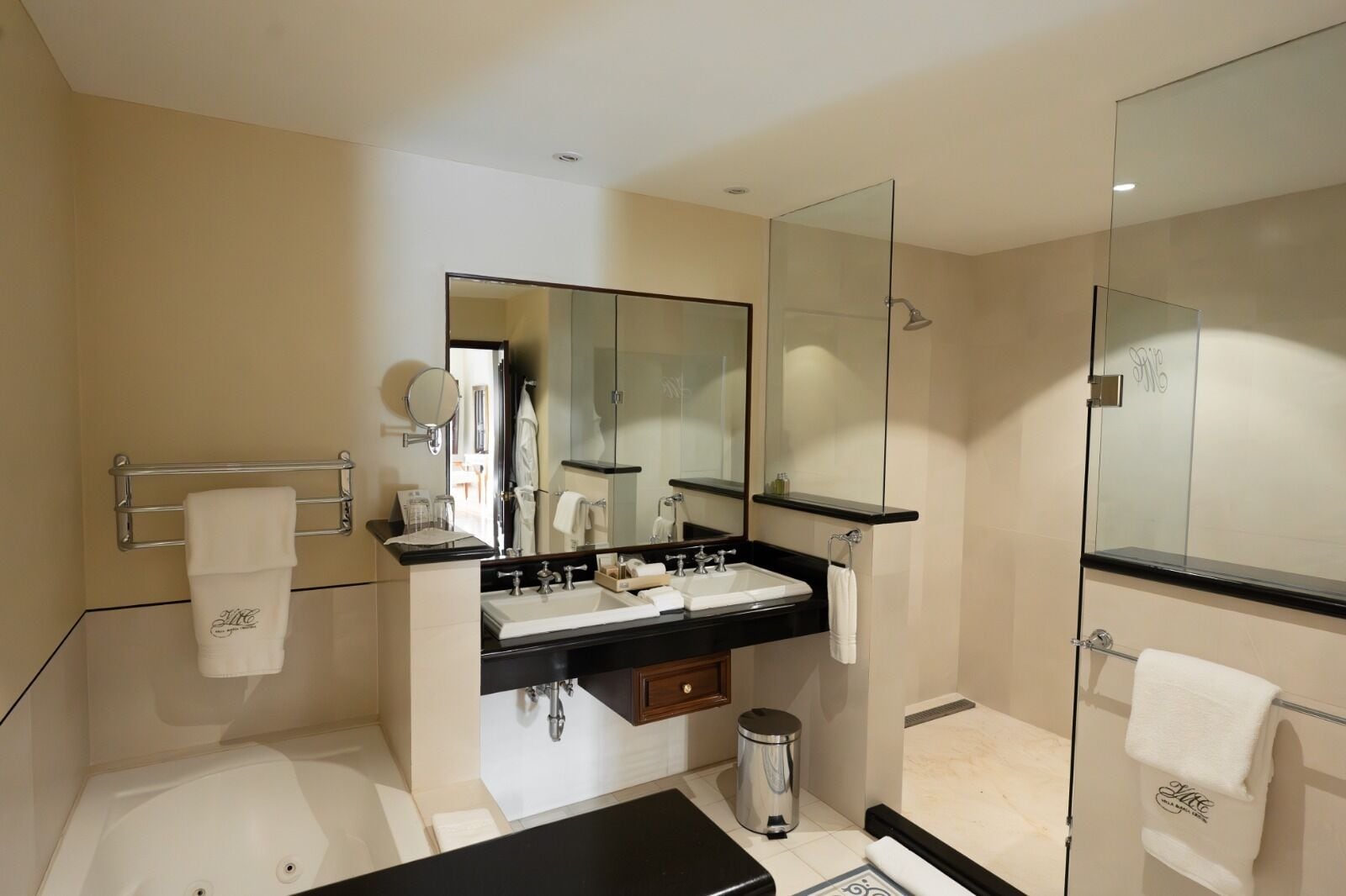 junior suite | bathroom | combined shower/bathtub, designer toiletries, hair dryer, bathrobes