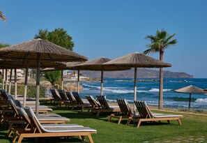 On the beach, beach cabanas, sun-loungers, beach umbrellas - Atlantica Kalliston Resort - Adults Only (Chania)