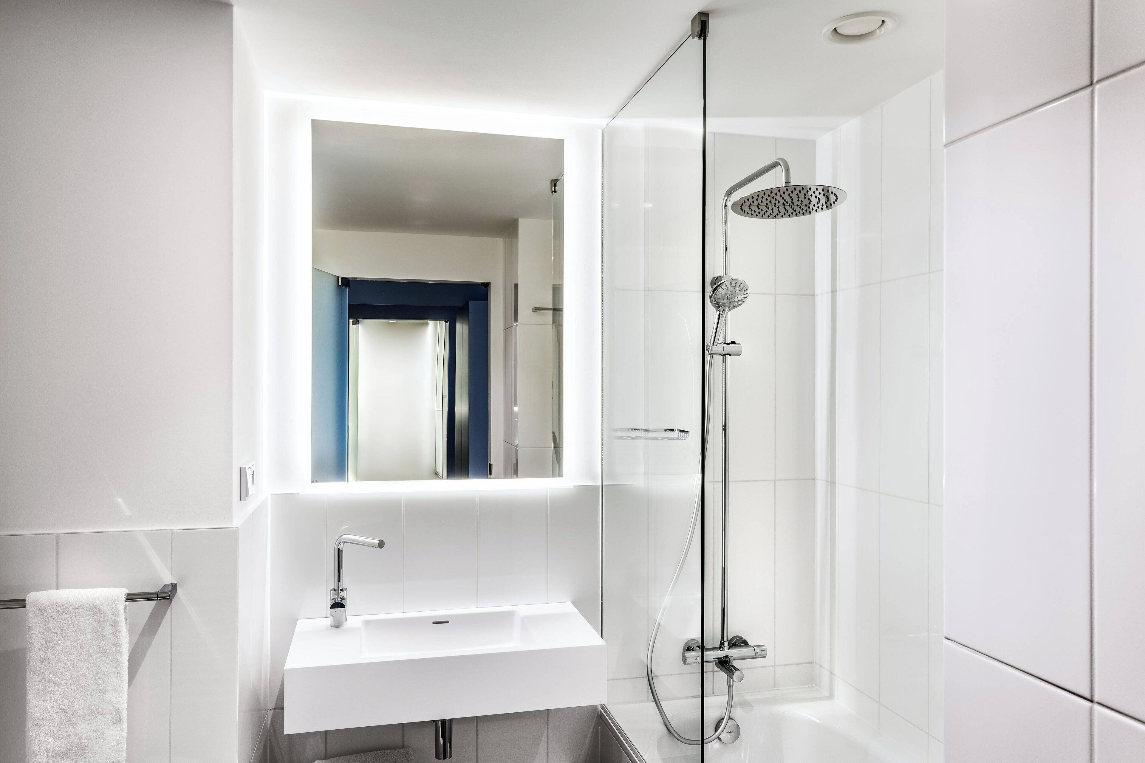 hydromassage showerhead, designer toiletries, hair dryer, towels