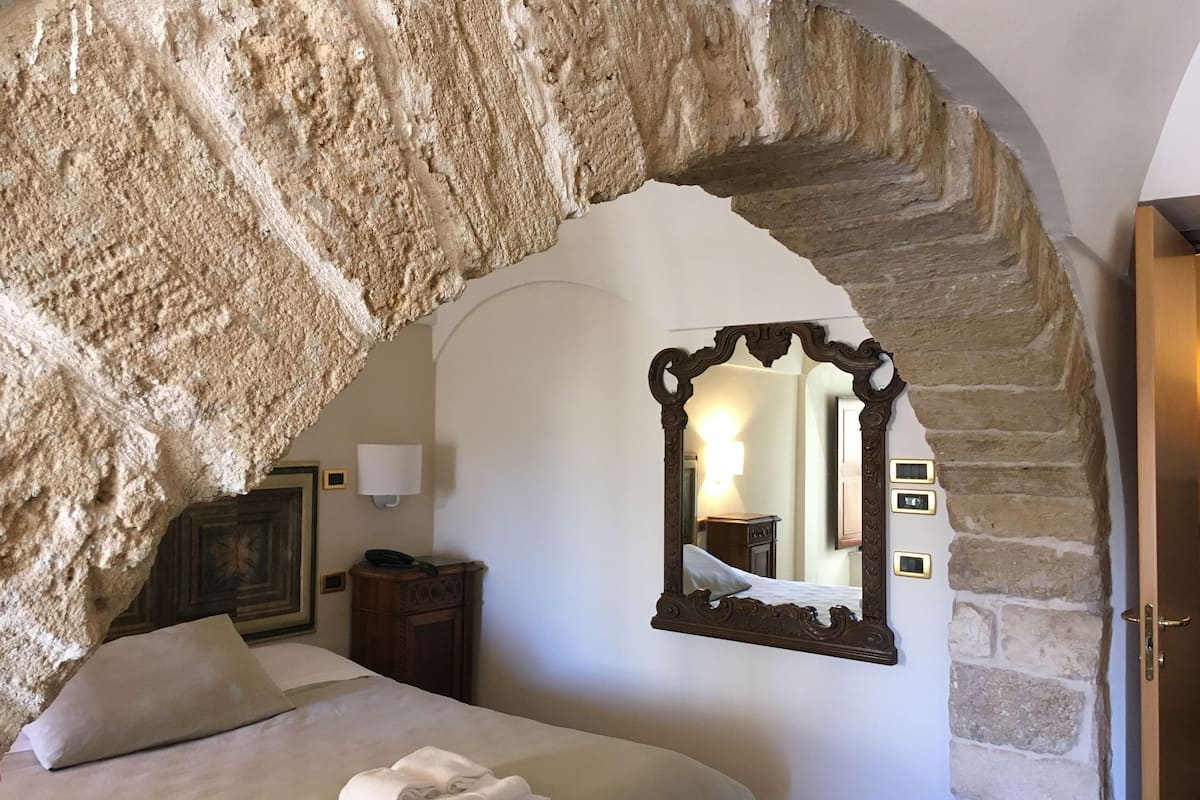 family apartment, 1 bedroom, kitchen, courtyard view | minibar, in-room safe, individually decorated, desk