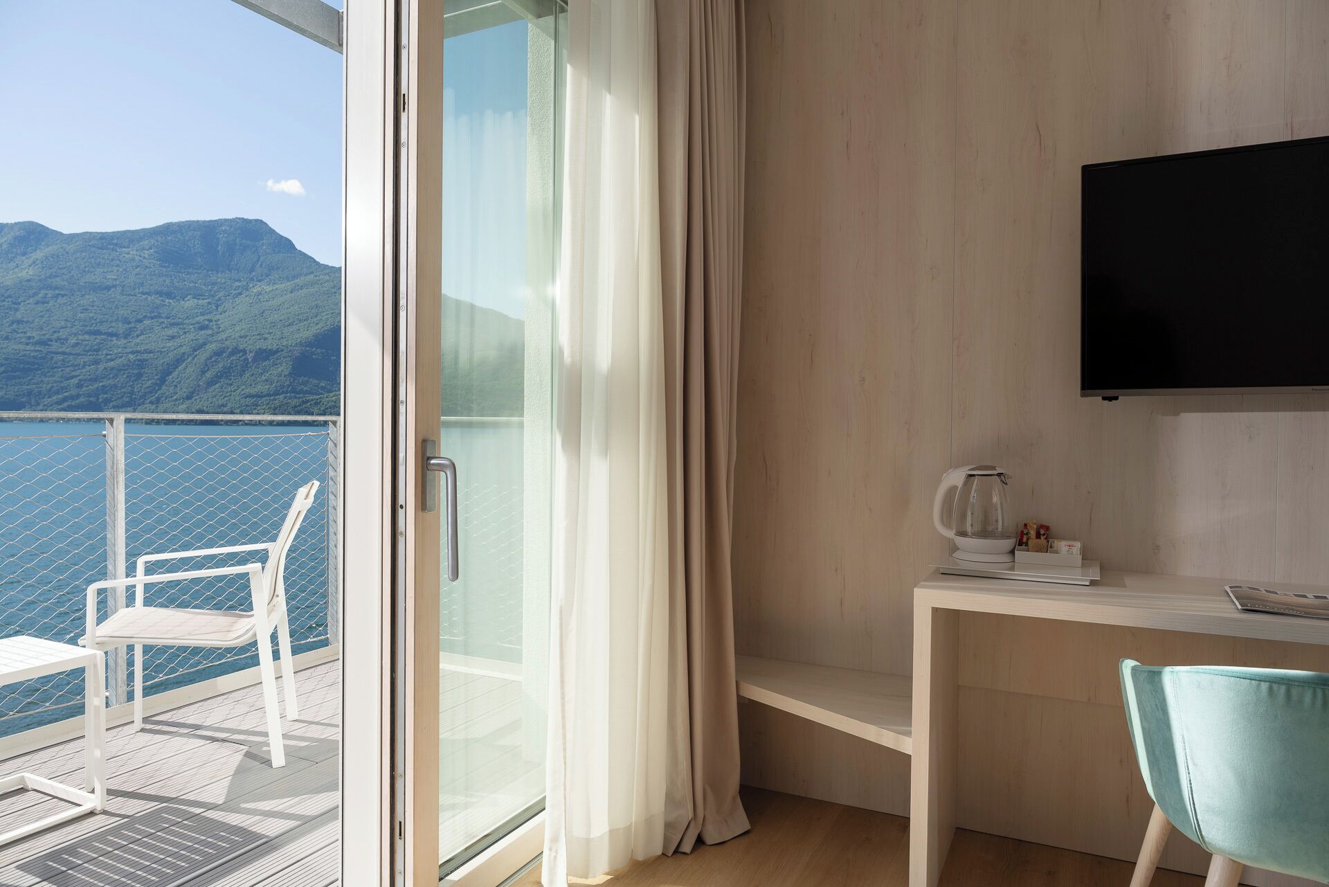 club double room, partial lake view | down duvets, minibar, in-room safe, laptop workspace