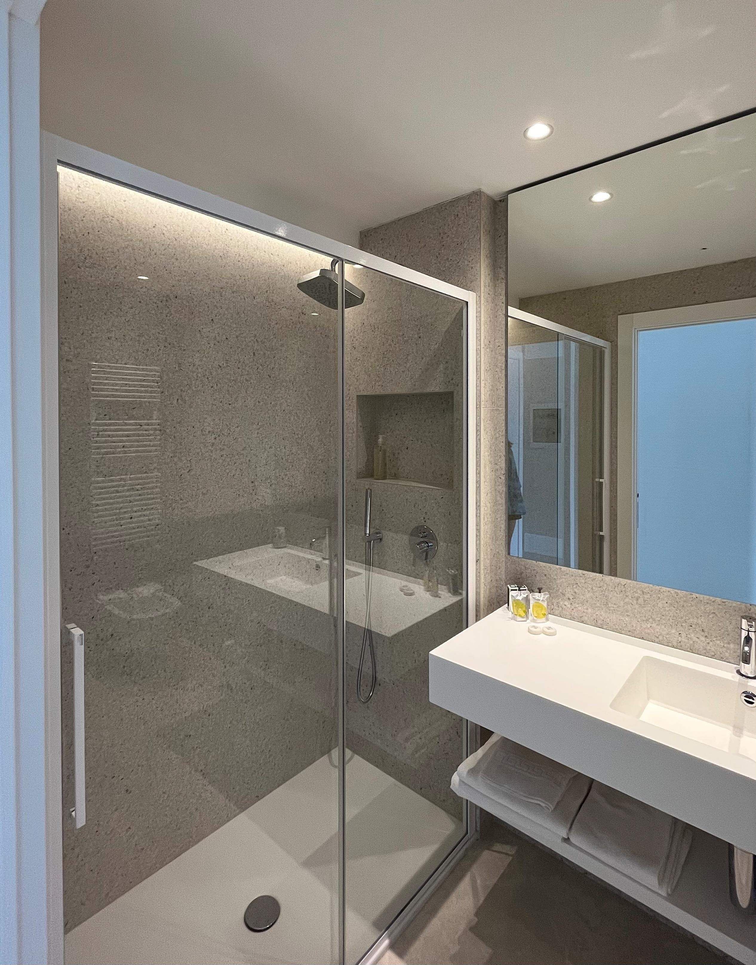 executive double room, lake view | bathroom | rainfall showerhead, hair dryer, towels, soap