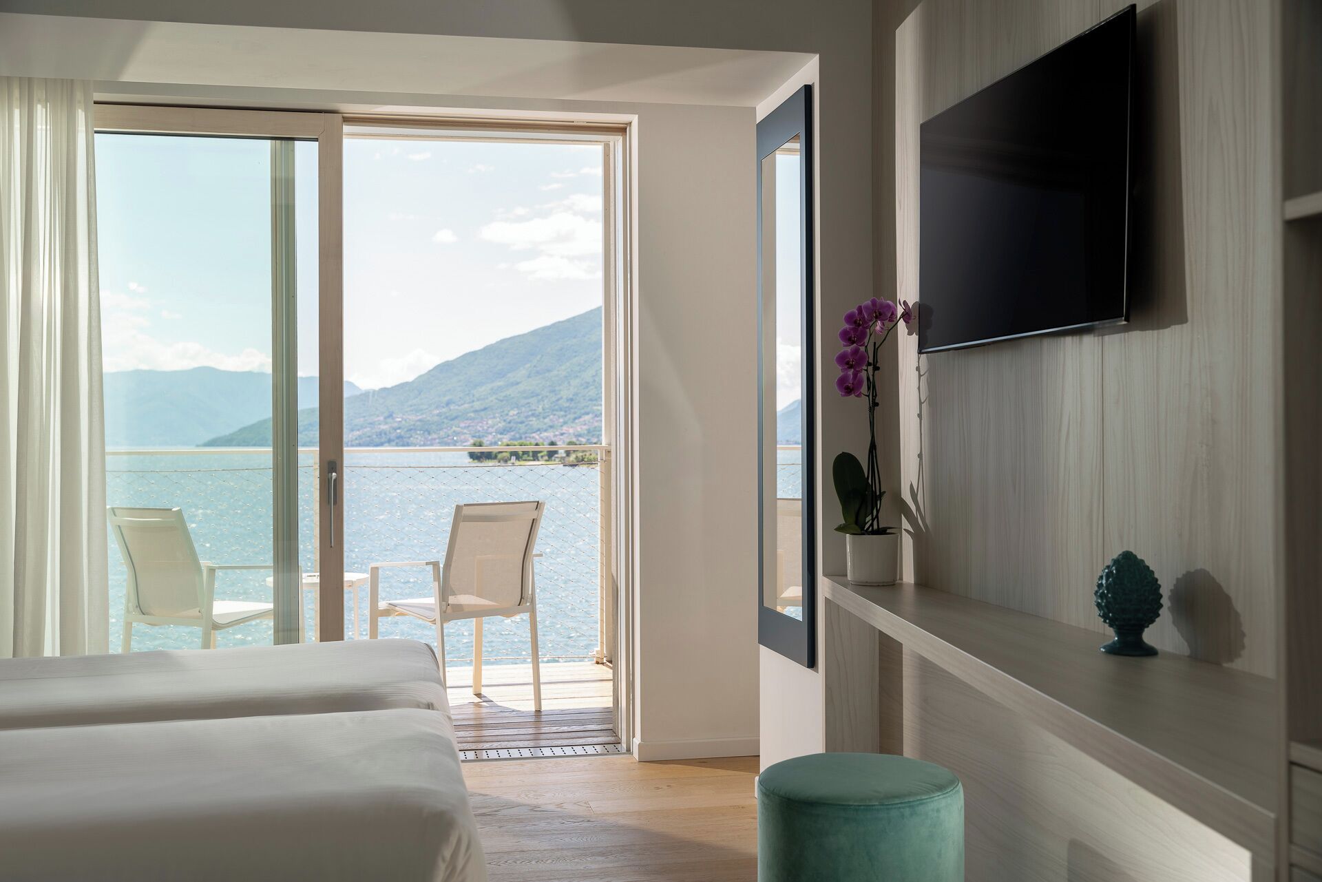 executive double room, lake view | down duvets, minibar, in-room safe, laptop workspace