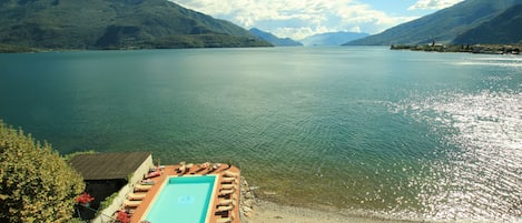 Private beach, black sand, sun loungers, beach umbrellas