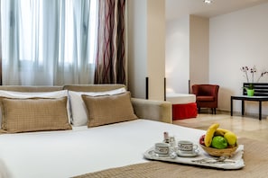 Family Room | Down comforters, minibar, in-room safe, individually furnished - Hotel Exe Suites 33 (Madrid)