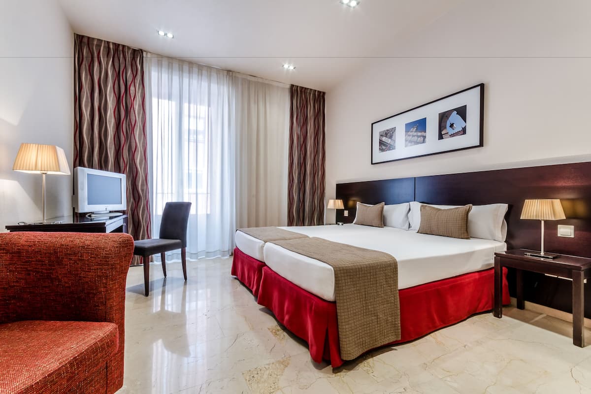 Donzen dekbedden, een minibar, een kluis op de kamer