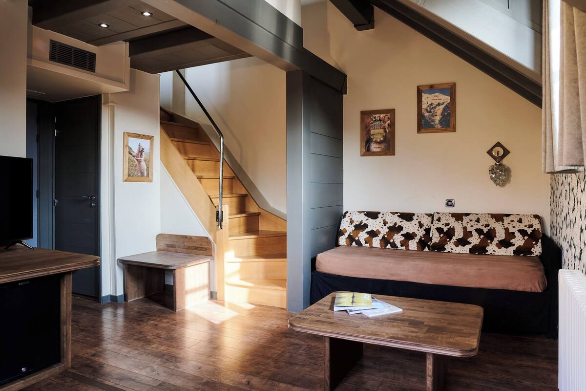 suite duplex | living area | flat-screen tv