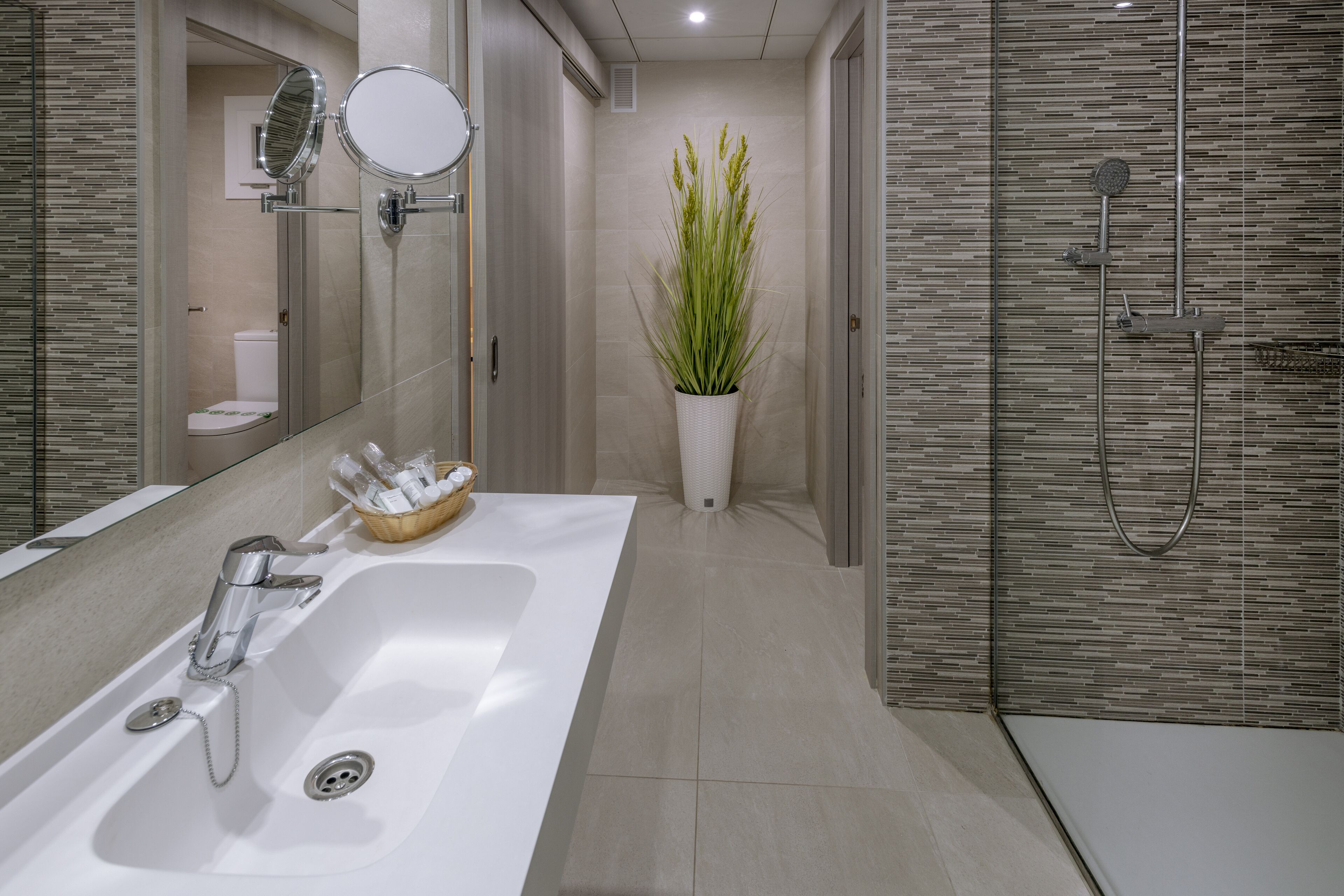 family room | bathroom | shower, designer toiletries, hair dryer, towels