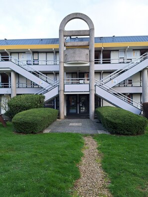 Stunning multi-story building with a central entrance and symmetrical design.