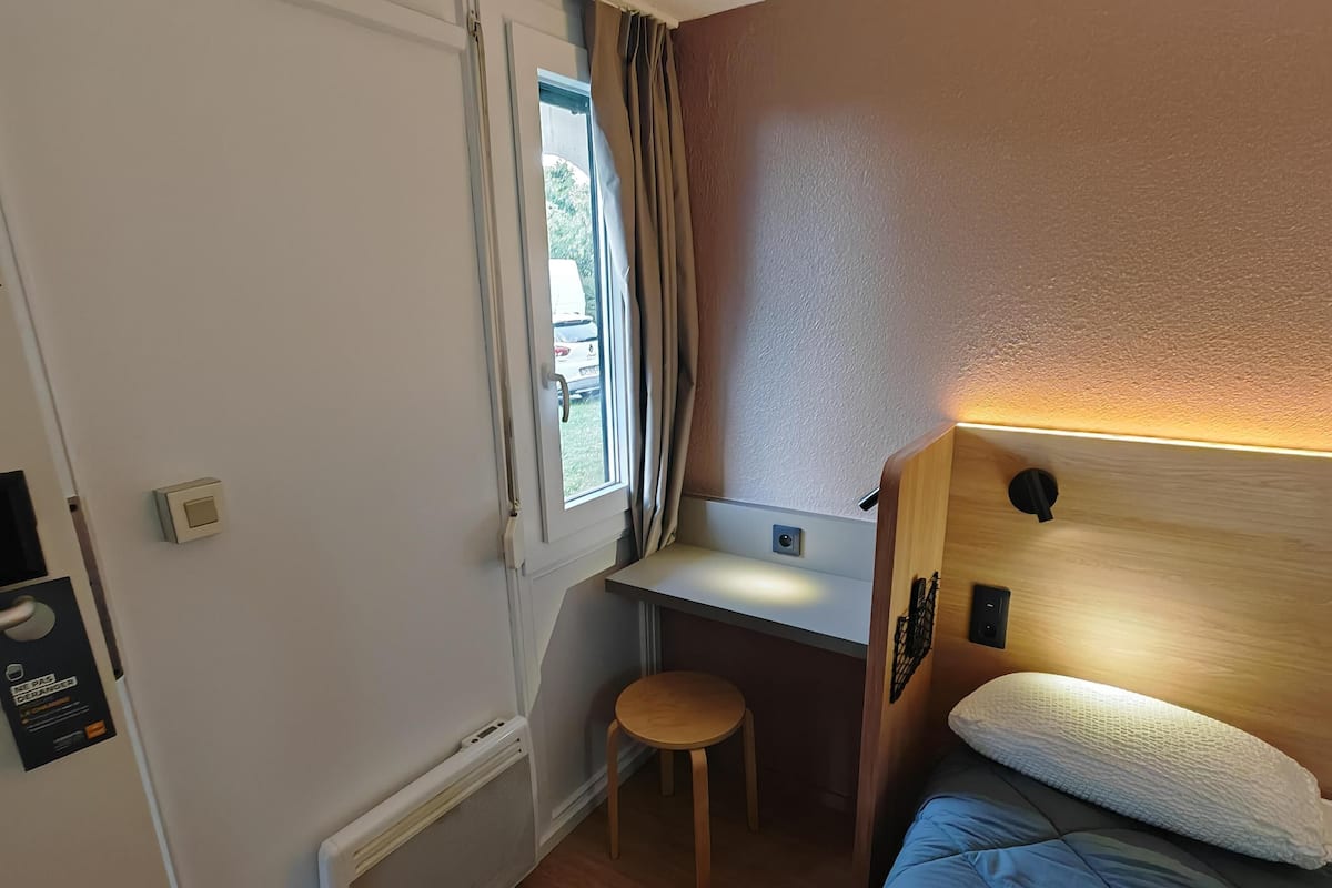 Desk, laptop workspace, blackout curtains, iron/ironing board