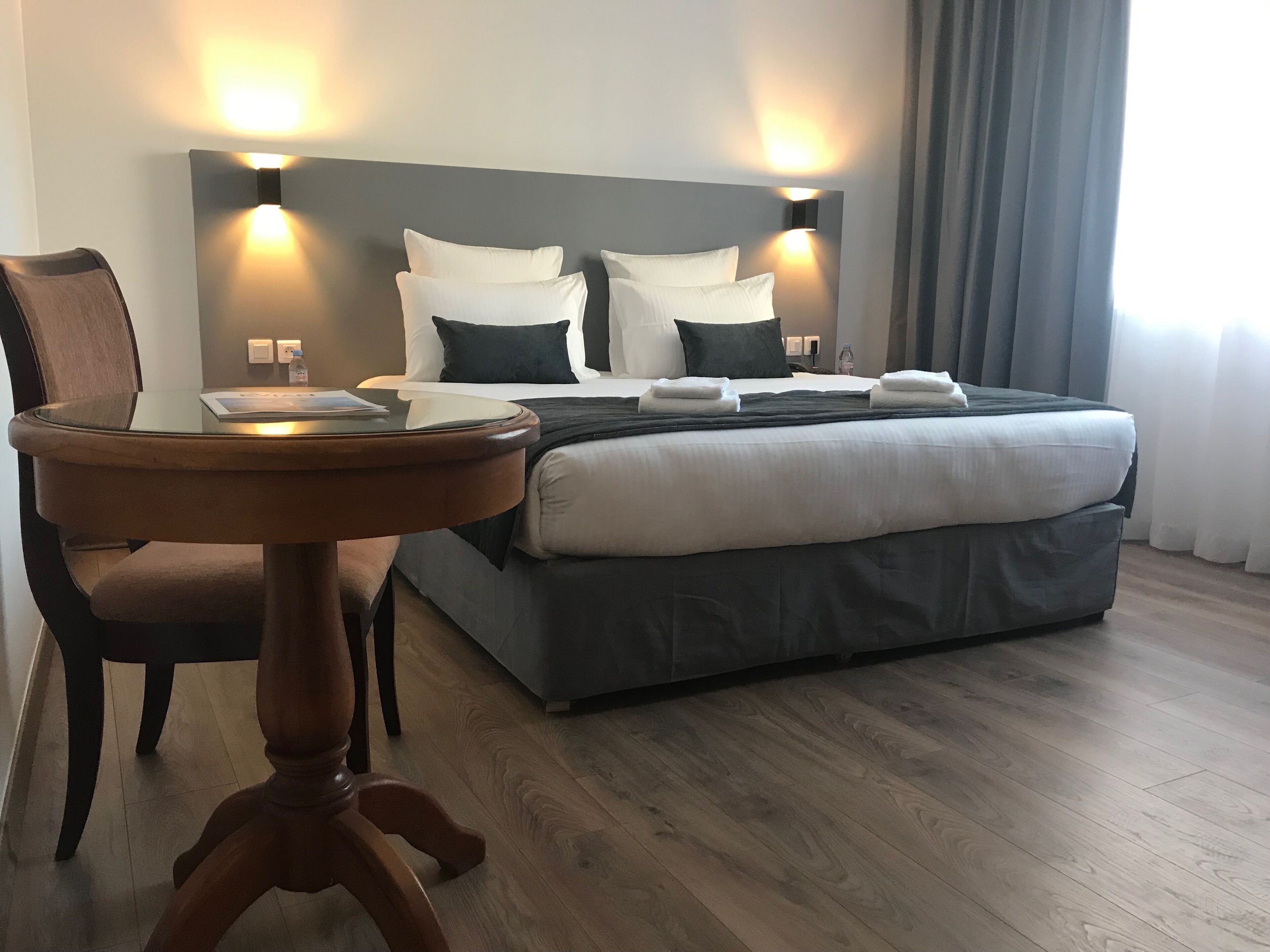 deluxe room lake view | premium bedding, in-room safe, desk, laptop workspace