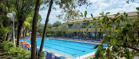 Seasonal outdoor pool, pool umbrellas, pool loungers