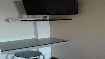 Desk, blackout curtains, free cots/infant beds, free WiFi