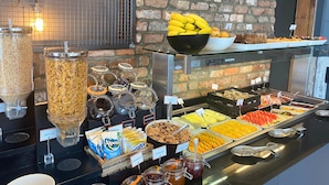 A buffet with various food options including cereals, fruits, and granola. - Absolute Hotel Limerick (Limerick)