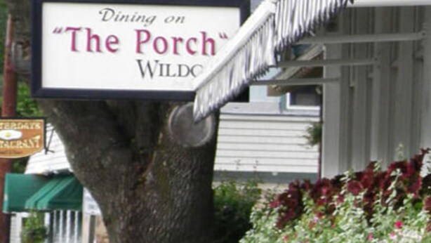A sign for 'Dining on The Porch' Wildco. - Wildcat Inn & Tavern (Jackson)