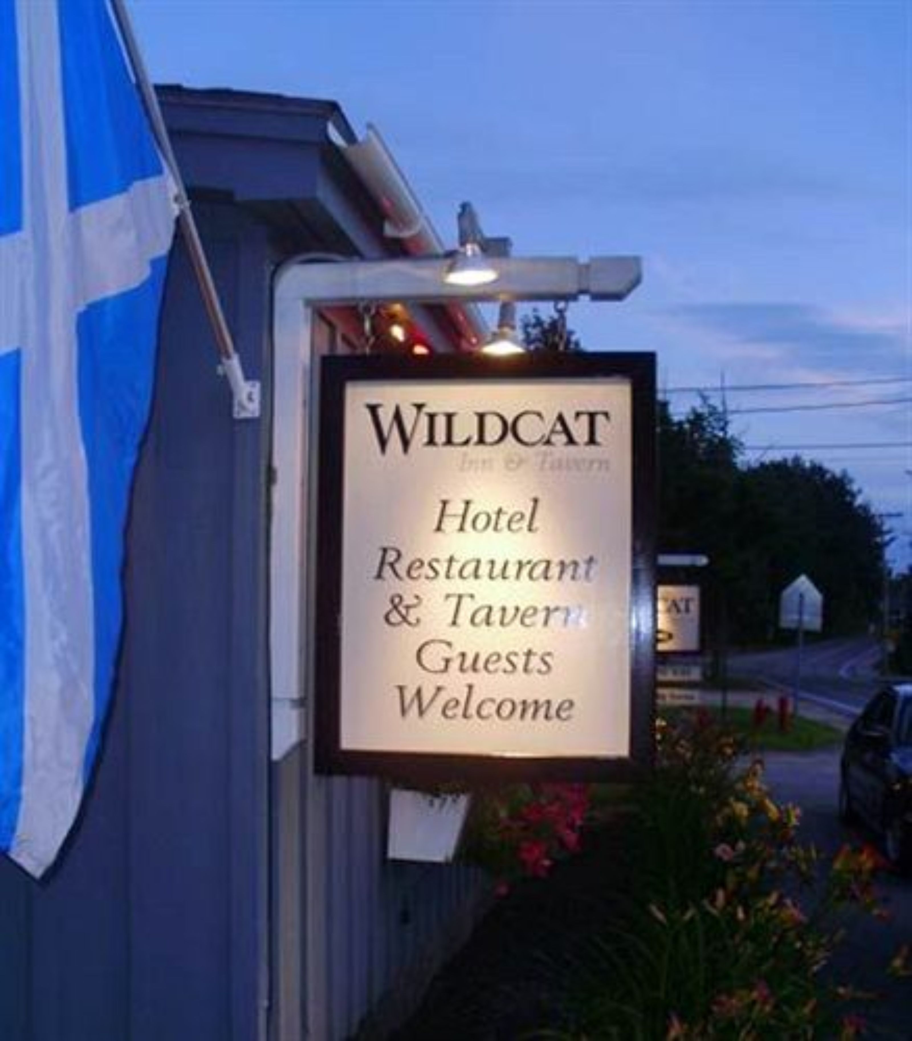 A sign for Wildcat Hotel, Restaurant & Tavern welcoming guests.