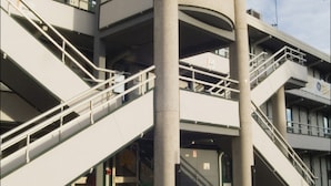 A multi-level parking structure with a digital display showing "PRIX DU JOUR 41".