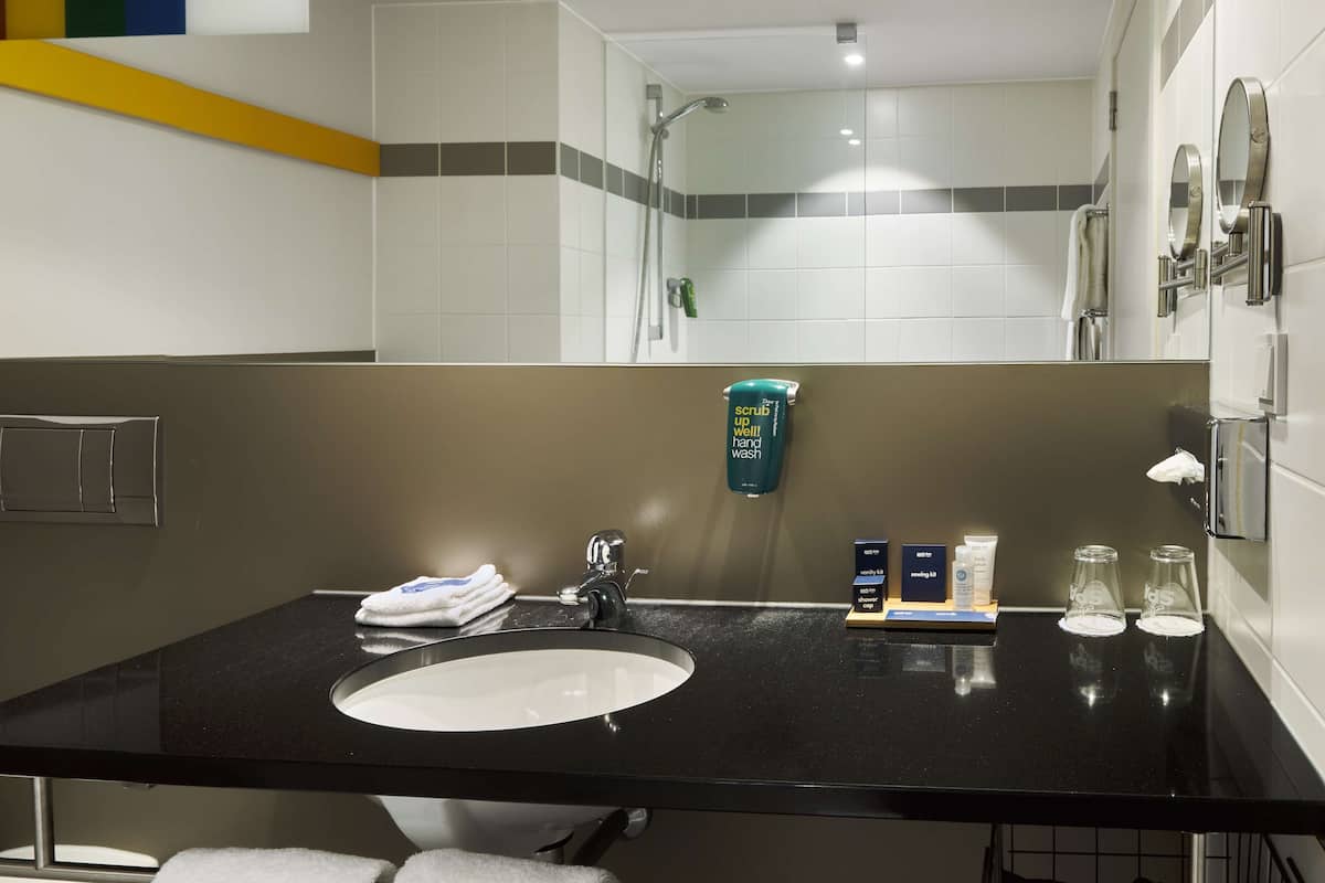 standard room (airport view) | bathroom | hair dryer, towels