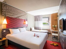 Premium bedding, desk, laptop workspace, blackout drapes