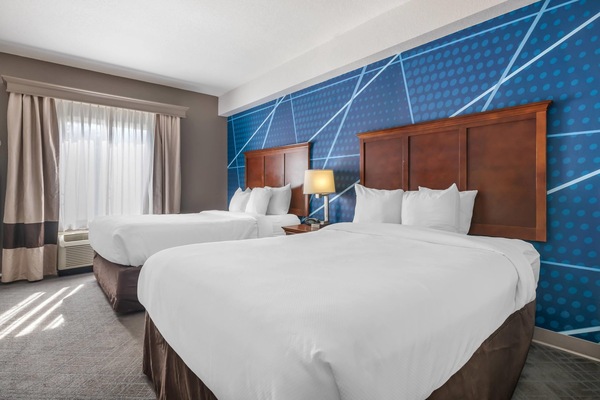Suite, Multiple Beds, Non Smoking (2 Queen Beds with Sofa Bed) | In-room safe, desk, laptop workspace, blackout drapes