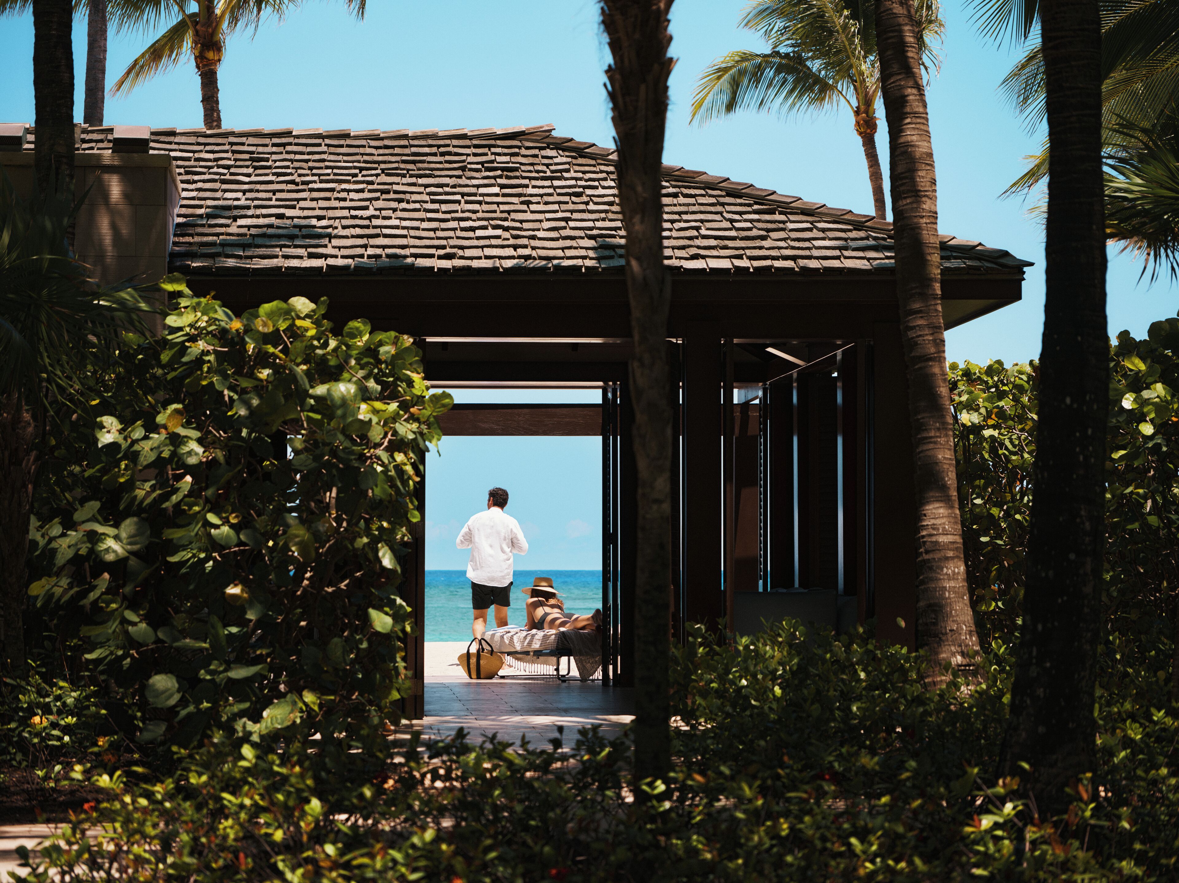 private beach, white sand, beach cabanas, sun-loungers