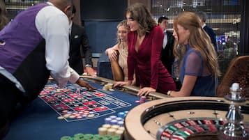 Experience the excitement of the roulette table in our vibrant casino, where you can place your bets and enjoy the city views.