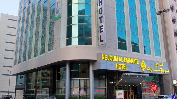 A hotel with a modern design, featuring large windows and a prominent 'HOTEL' sign. - Nejoum Al Emarate (Sharjah)