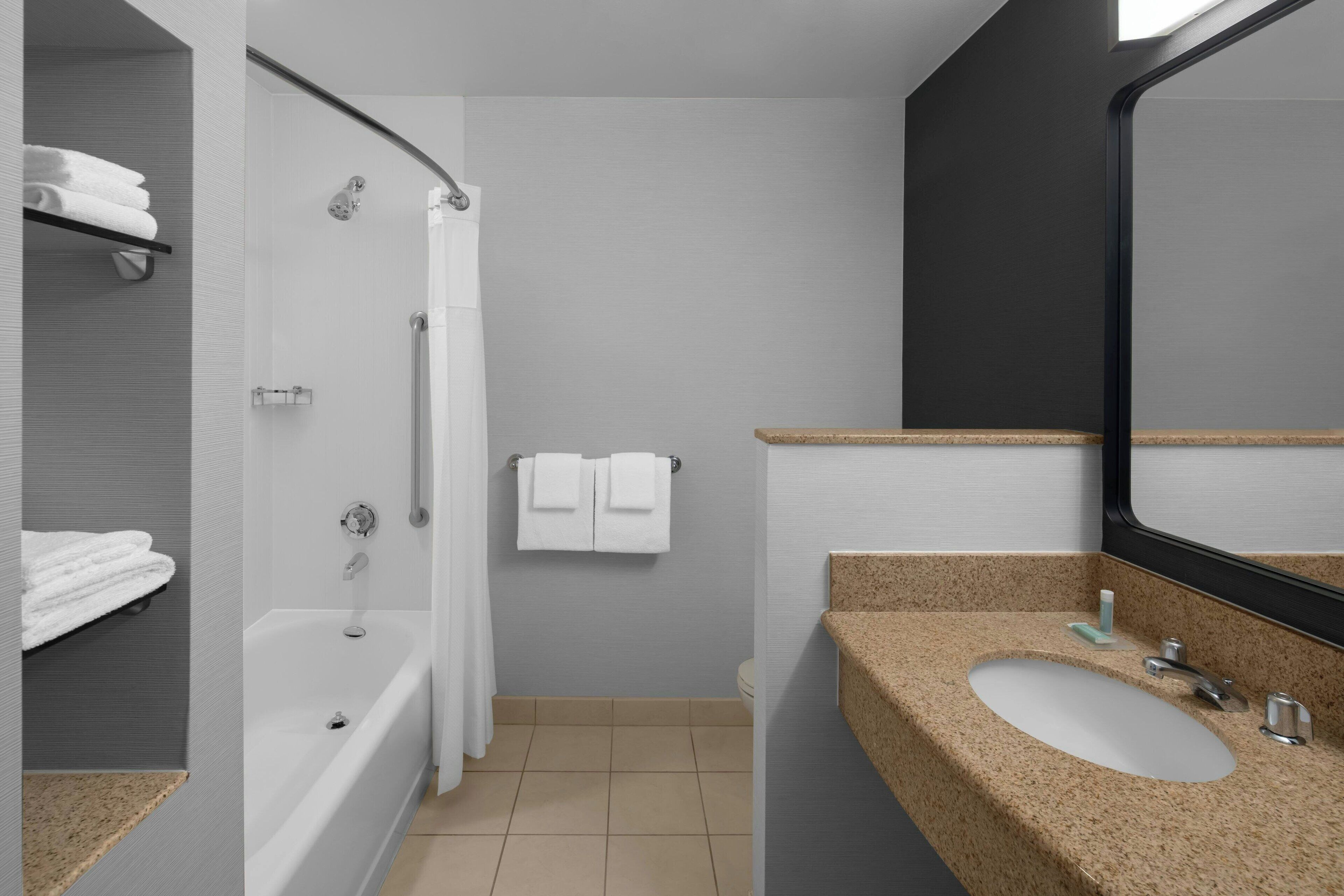 combined shower/bathtub, deep-soaking bathtub, rainfall showerhead